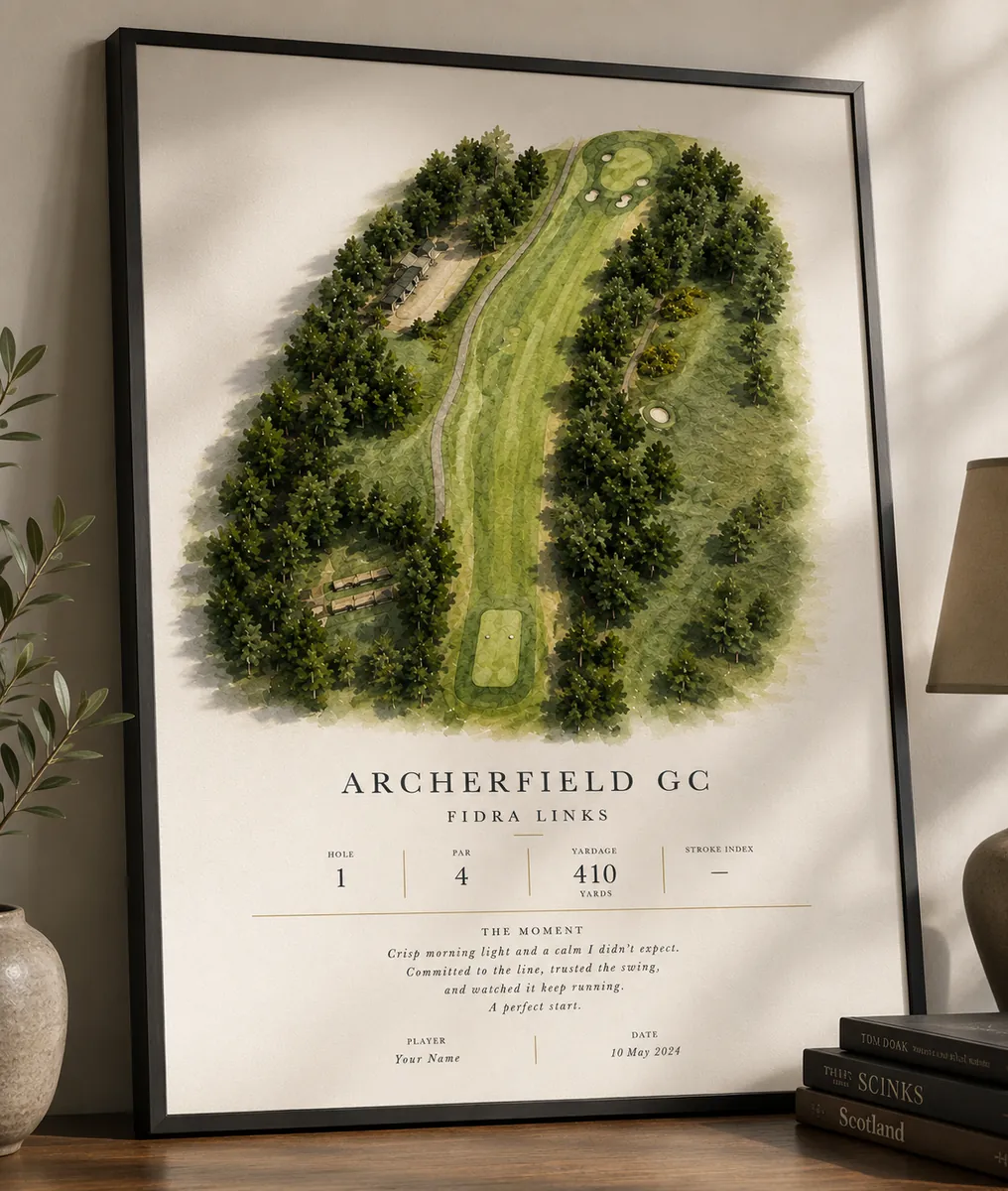Framed Archerfield GC golf hole print leaning on a wooden sideboard
